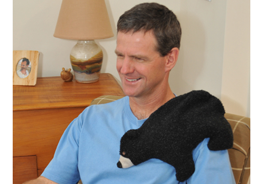 Black Bear microwave heating pad relaxes stiff back and shoulder muscles