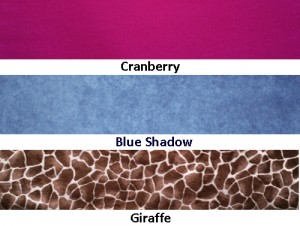 Swatches of fabric for XL microwave Neck Warmers in cranberry flannel, blue shadow print flannel, and giraffe pattern in soft plush