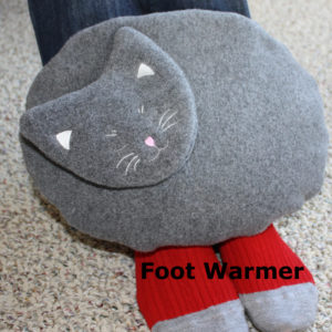 Maine Warmers Gray Cat resting on top of feet