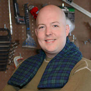 Man using extra long neck warmer while working in a cold woodshop