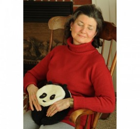 Woman relaxing with Panda Bear Warmer