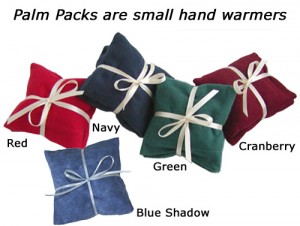 Small flannel covered hand warmers called Palm Packs in Red, Navy, Blue Shadow, Forest Green, & Cranberry