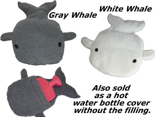 Gray whale and white whale microwave heating pads and a gray whale hot water bottle cover without the corn filling