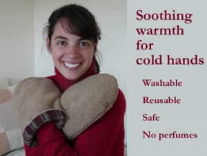 Woman warming hands with hand warmers with text that says, "Soothing warmth for cold hands. Washable, Reusable, Safe, No perfumes"