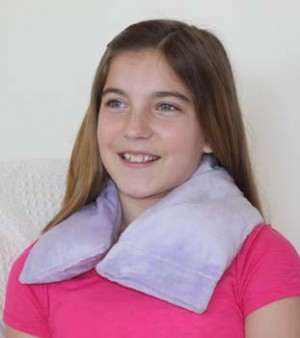 Teenager using microwave neck warmer to warm up