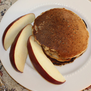 Gluten free oat pancakes with apple slices