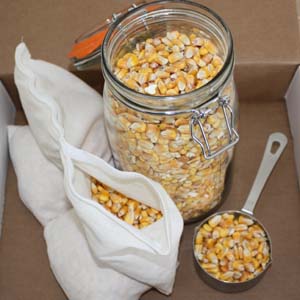 Whole corn in a Mason jar and inside a back warmer insert