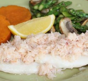 Haddock dinner with crab meat topping , sweet potatoes, and asparagus