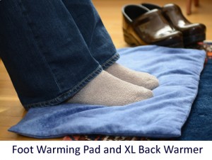 Woman warming feet on microwave foot warmer pad that can also be used as a back warmer
