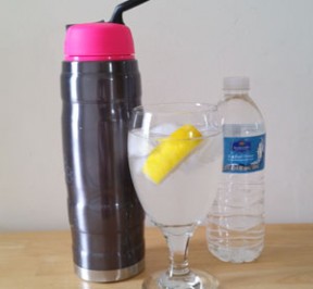 photo of thermos type athletic water container, glass of water with lemon, bottled water