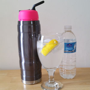 photo of thermos type athletic water container, glass of water with lemon, bottled water