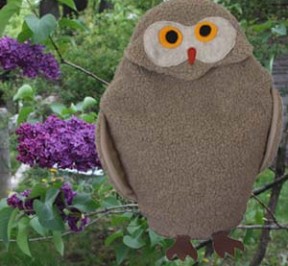 Owl microwave heating pad with lilacs in spring