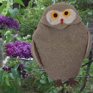 Owl microwave heating pad with lilacs in spring