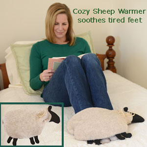 Woman using Cozy Sheep microwave heating pad to soothe tired feet after gardening