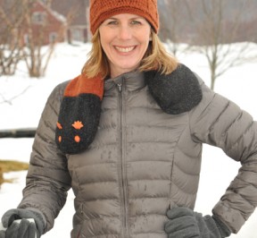 Woman keeping warm with Woolly Bear neck heating pad