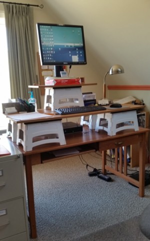 Stand up computer desk made with step stools and wood panels