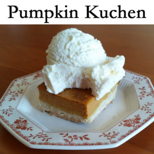Pumpkin Kuchen Gluten free dessert on a plate with vanilla frozen yogurt on top