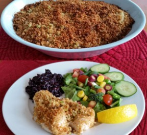 Baked Scallops in a baking dish and on a plate with a green salad and black rice