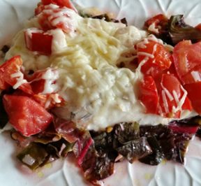 Baked Haddock Florentine on a white plate